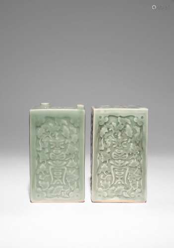 TWO JAPANESE CELADON MOULDED SAKE BOTTLES (TOKKURI)