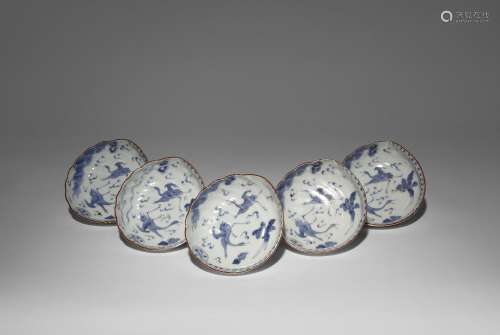 A SET OF FIVE JAPANESE MOULDED BLUE AND WHITE DISHES