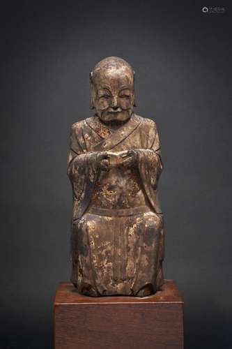 A LACQUERED WOOD FIGURE OF A MONK