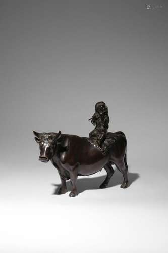 A JAPANESE BRONZE OKIMONO OF A BOY AND OX BY SHUHO