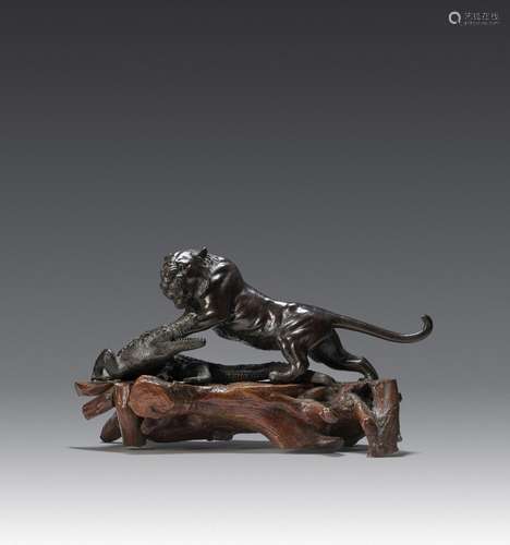 AN IMPRESSIVE JAPANESE BRONZE OKIMONO OF A TIGER AND CROCODI...