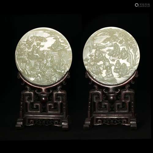 A PAIR OF CIRCULAR WHITE JADE 'FIGURES' TABLESCREENS