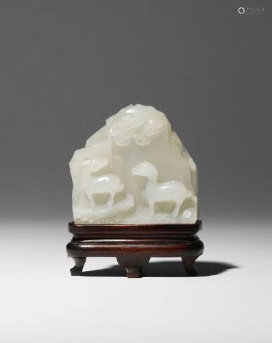 A SMALL CHINESE WHITE JADE 'MOUNTAIN' CARVING