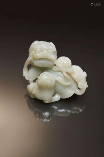 A GOOD LARGE CHINESE PALE CELADON JADE BUDDHIST LION GROUP