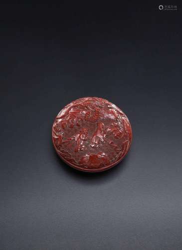 A CHINESE CINNABAR LACQUER CIRCULAR 'SCHOLARS' BOX AND COVER