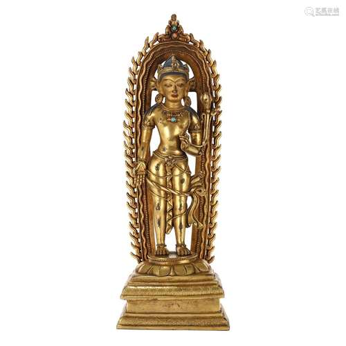 A GILT-BRONZE FIGURE OF STANDING SHAKYAMUNI