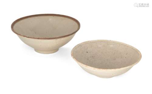 Two Chinese white-glazed bowls, Song/Yuan dynasty, both on s...