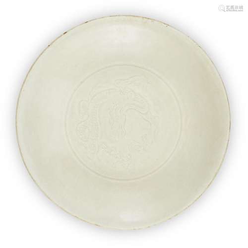 A Chinese Dingyao carved 'dragon' dish, Song/Yuan dynasty, o...