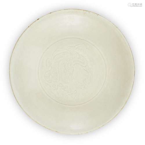 A Chinese Dingyao carved 'dragon' dish, Song/Yuan dynasty, o...