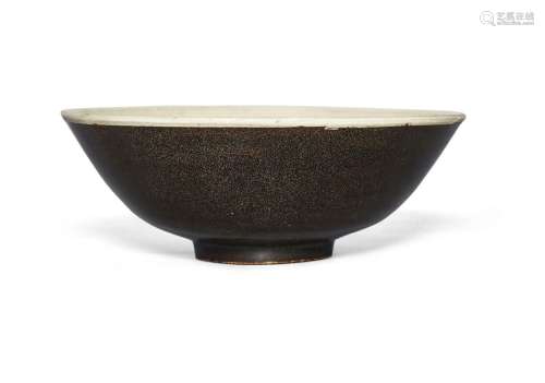 A Chinese porcelain black-glazed bowl, Song dynasty, on a sh...