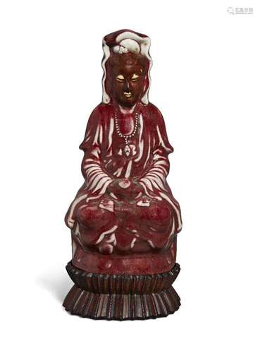 A Chinese porcelain monochrome langyao figure of Guanyin, Re...