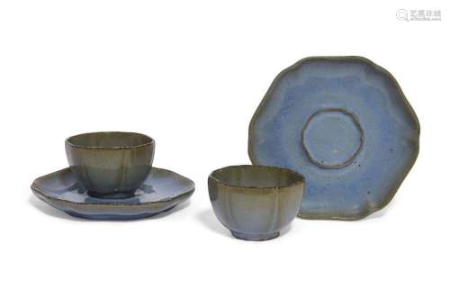 A pair of Chinese Yijun pottery teabowls and saucers, 17th/1...