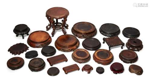 Twenty-five Chinese and Japanese wood stands (25)<br />
<br ...