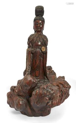 A Chinese gilt-painted rootwood carving of Guanyin, 20th cen...