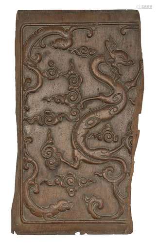 A Chinese huanghuali 'dragons' panel, 17th/18th century, car...