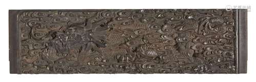 A Chinese zitan 'dragon' panel, 18th century, carved in reli...