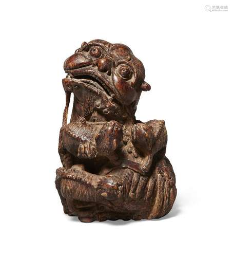 A Chinese carved bamboo figure of a Buddhist lion, 19th cent...