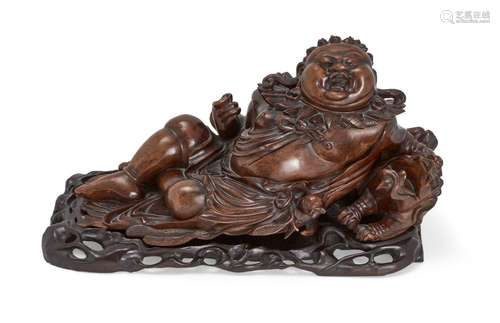 A Chinese hardwood carving of Hotei, early 20th century, car...