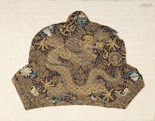 A Chinese shaped kesi dragon fragment, 19th century, the dar...