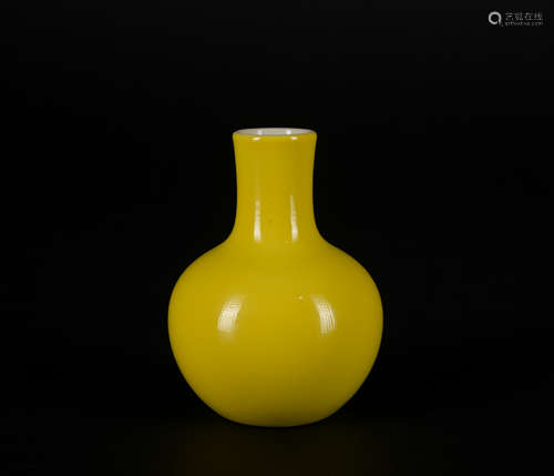 A yellow glazed vase