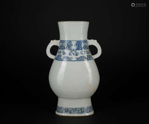 A blue and white vase with two ears
