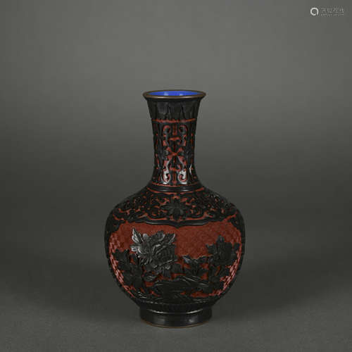 A carved red lacquer vase