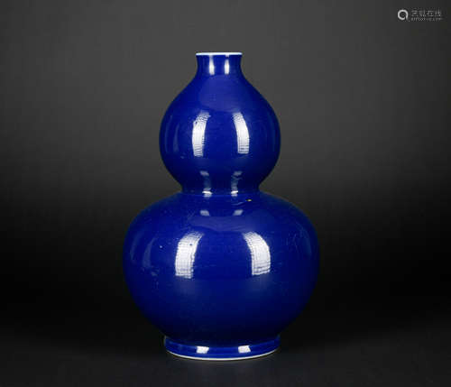 A blue glazed gourd-shaped vase