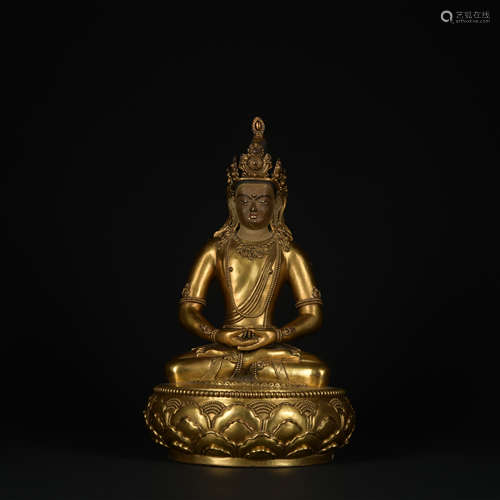 A gilt-bronze statue of Amitabha Buddha