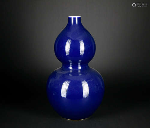 A blue glazed gourd-shaped vase