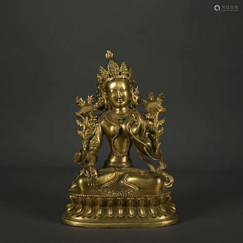 A gilt-bronze statue of Tara