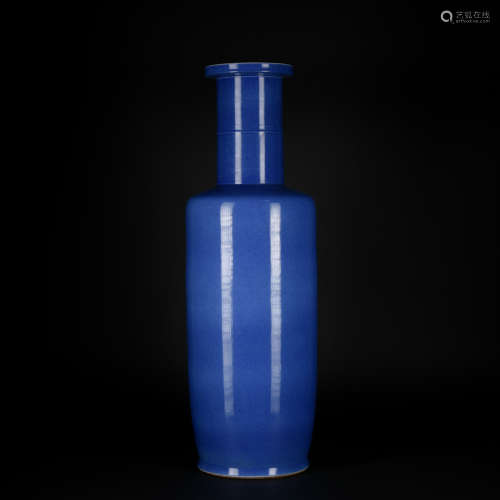 A blue glazed vase like wooden club