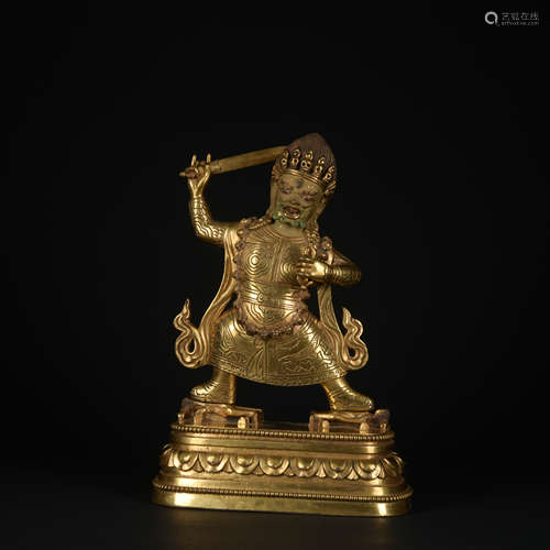 A gilt-bronze statue of Mammon