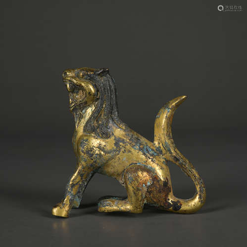 A gilt-bronze beast ornament