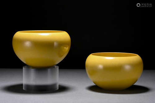 A pair of yellow glazed earthen bowl