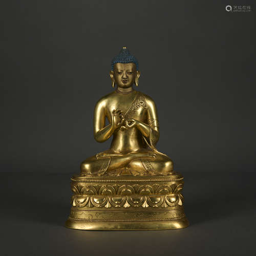 A gilt-bronze statue of Sakyamumi