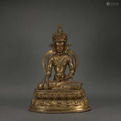 A gilt-bronze statue of Amitabha Buddha