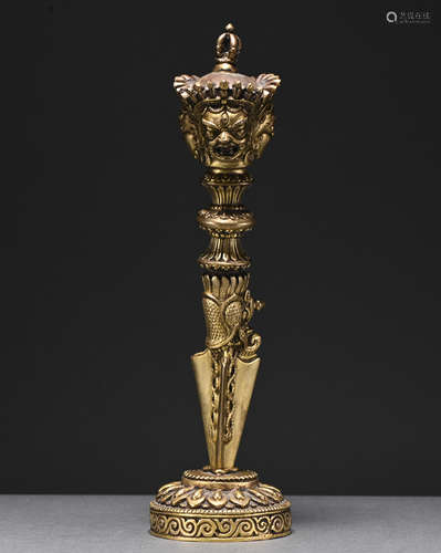 A gilt-bronze musical instrument