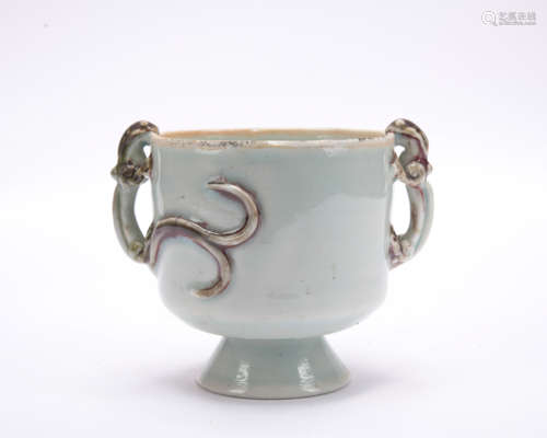 A celadon-glazed 'double dragon' cup