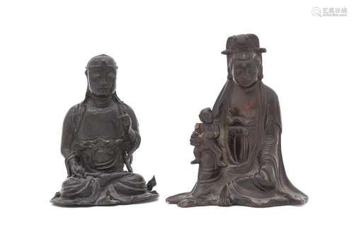 A Chinese bronze figure of Guanyin and child