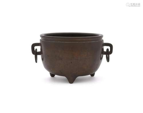 A Chinese bronze tripod censer