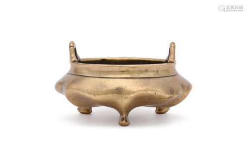 A Chinese bronze tripod censer