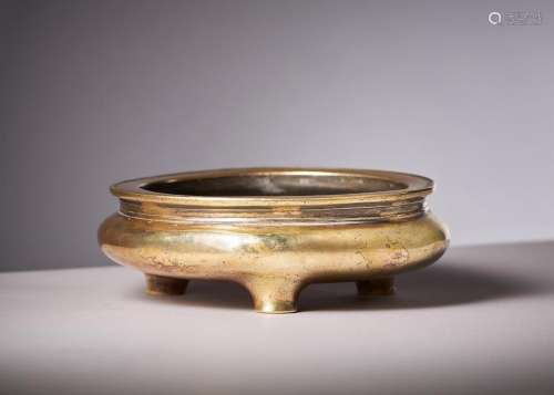 A Chinese bronze tripod gold splash censer