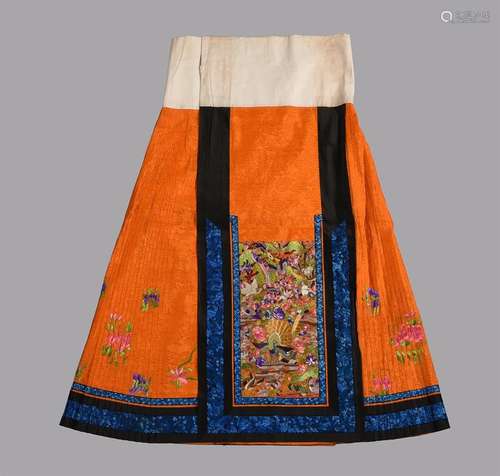 A fine Chinese summer damask bright orange skirt worn by a H...