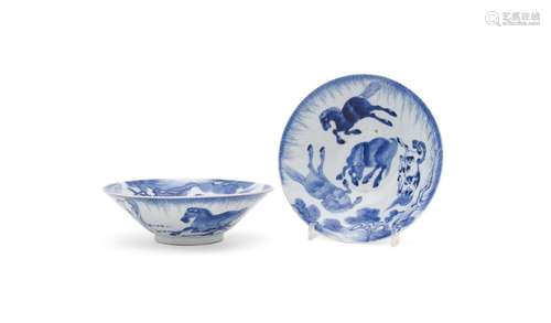 A pair of Chinese blue and white eight horses flaring bowls