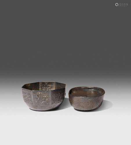 A CHINESE SILVER INGOT AND A SMALL OCTAGONAL SILVER BOWL