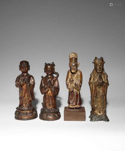 THREE CHINESE GILT-LACQUERED BRONZE FIGURES AND A GILT-WOOD ...