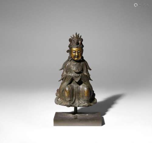 A CHINESE PARCEL-GILT AND LACQUERED BRONZE SEATED BODHISATTV...