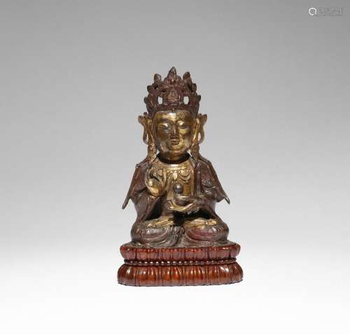 A CHINESE PARCEL-GILT BRONZE FIGURE OF GUANYIN