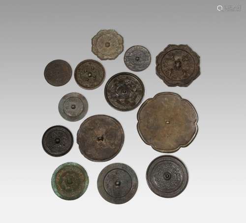 A COLLECTION OF THIRTEEN CHINESE BRONZE MIRRORS
