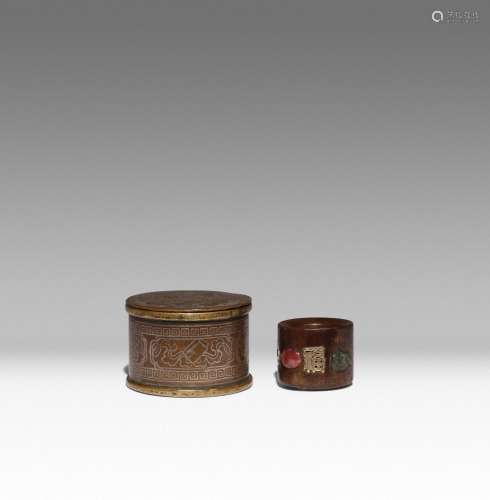 A CHINESE HARDWOOD ARCHER'S RING AND A SILVER-INLAID BOX AND...